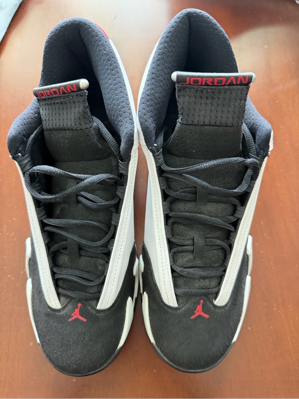 Nike Air Jordan 14 Retro "Black Toe" sneakers.